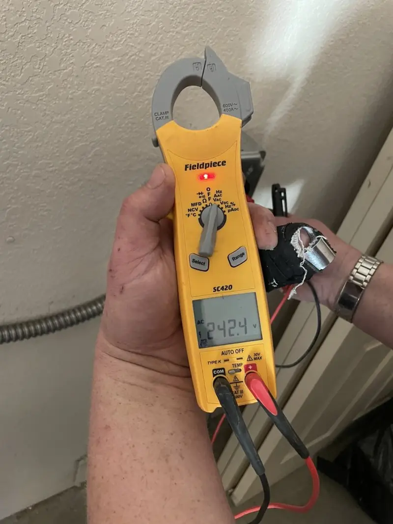 Voltage testing with clamp meter during Aluminum Wiring Replacement in Clinton